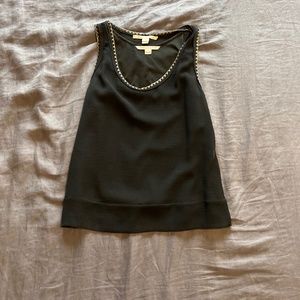 Black tank top with gold chain detail by Diane von Furstenberg